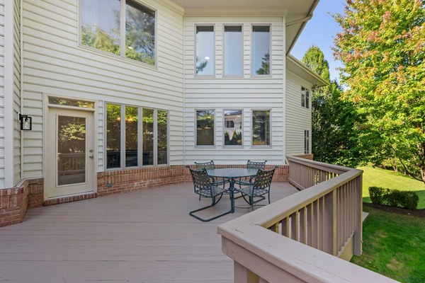 Deck overlooking the fenced rear yard