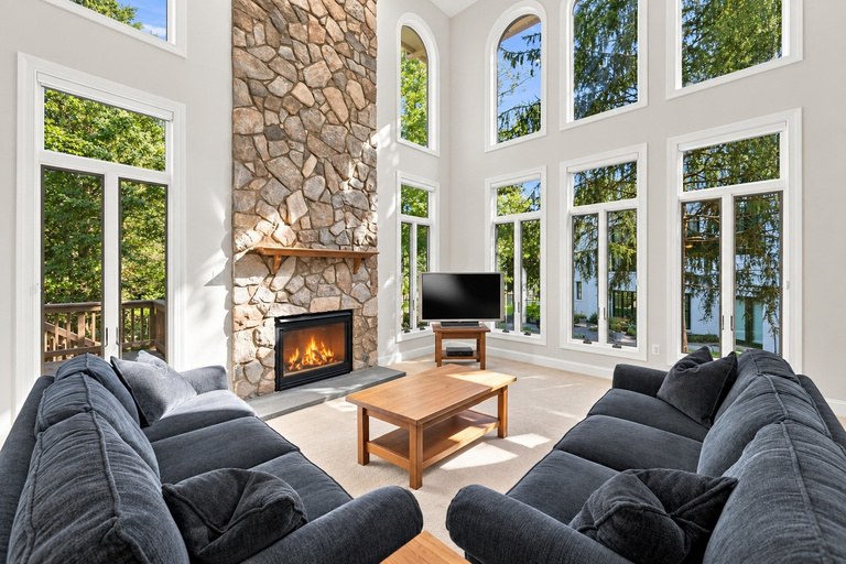 Family room with floor-to-ceiling stone fireplace
