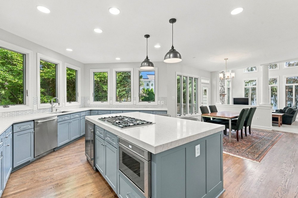 Gourmet kitchen with quartz island and cooktop