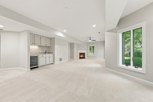 Lower level wet bar and fireplace